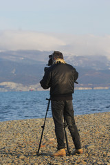 Video operator on a winter beach