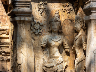 Fototapeta na wymiar Ancient stucco patterns ,Wat Chet Yot temple,B.E. 1998 King Tilokaraj The 9th King of the Mangrai Dynasty built of laterite decorated with stucco designs. Is a Bodh Gaya pagoda India.