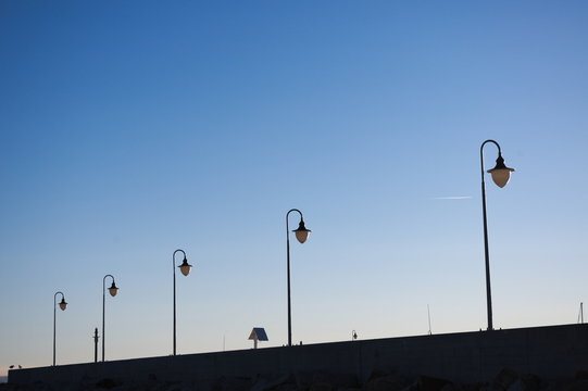 Street Lights Against Clear Blue Sky