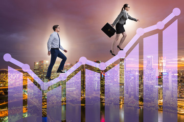 Business people climbing bar charts in growth concept