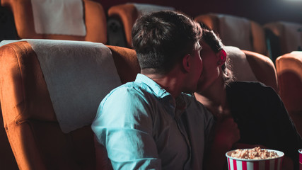 People audience watching movie in the movie theater cinema. Group recreation activity and...