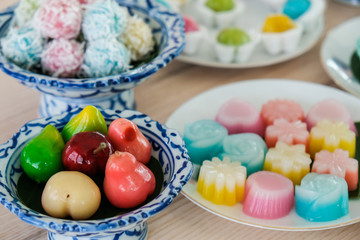 Close up of a set of Thai sweet dessert (Khanom Wan Thai) on the table. Thai desserts are a sweet and sometimes filling snack opposed to a light and airy Western style dessert.