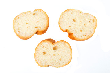 Sliced baguettes on white background.
