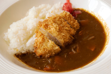 Japanese Curry Rice Deep-fried pork cutlets on a white plate