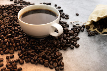 Hot Americano coffee with roasted coffee beans