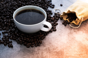 Hot Americano coffee with roasted coffee beans