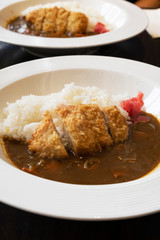 Japanese Curry Rice Deep-fried pork cutlets on a white plate