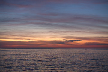 Beautiful pink color clouds on the sky.