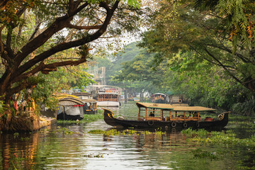 Beautiful Kerala backwaters landscape with traditional houseboats at sunset - obrazy, fototapety, plakaty