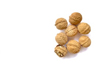 walnuts and nutcracker on white background copy space