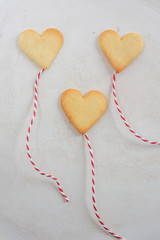 Valentines Day Concept: closeup of fresh baked heart shaped cookies on a table