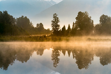 Mirror reflection water Matheson lake, New Zealand natural landscape background