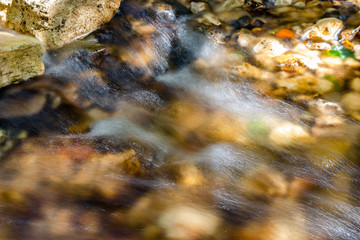 Stormy stream of water on a rocky small river