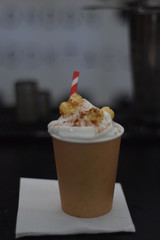 cocktail with popcorn in a paper cup