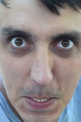 young man funny face close up