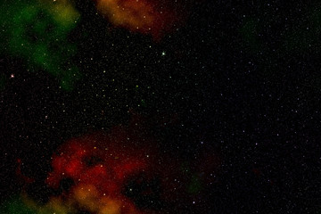 Outer space with colored nebulae and stars.
