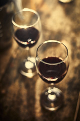 Red wine on wood background..