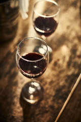 Red wine on wood background..