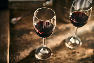Red wine on wood background..