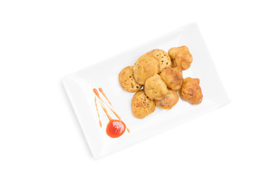 Flat lay view of a crunchy Cucur Ikan Bilis or Anchovies Fritters a Malay traditional evening dish.