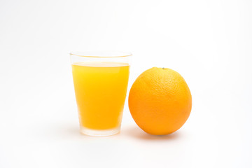Glass of orange juice with orange fruit on white background.
