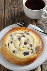 Fresh bun with cottage cheese and coffee