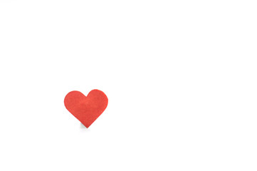 Red heart on a white background with a shadow. Concept of love.