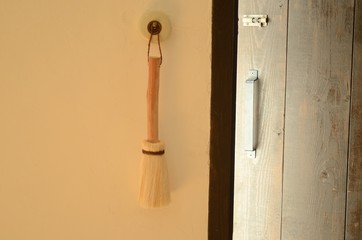 Broom hung on the wall