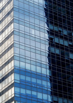 Abstract minimalist architecture,modern office building with reflection in windows of building