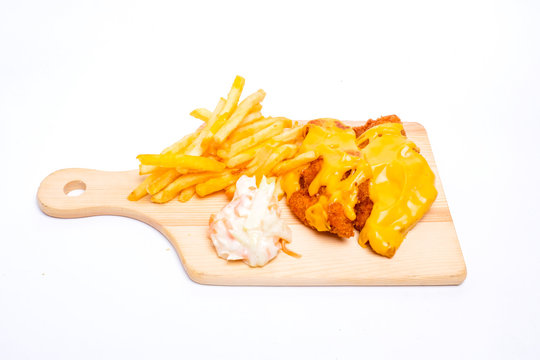 A picture of cheesy chicken breast set with fries and coleslaw insight 