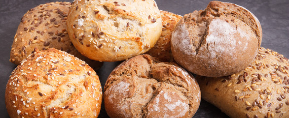 Stack of fresh baked rolls with seeds