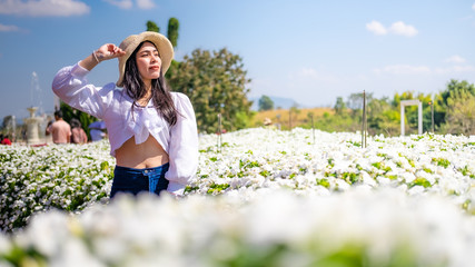 Asian women with flower fields, Thai tourists with flower fields, taking pictures with flowers.