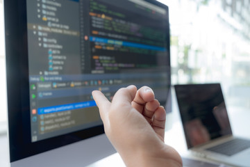 Programmers work on the development of coding and coding technology on white desks and website design, software, data processing companies, servers.