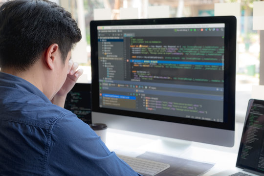Programmers work on the development of coding and coding technology on white desks and website design, software, data processing companies, servers.