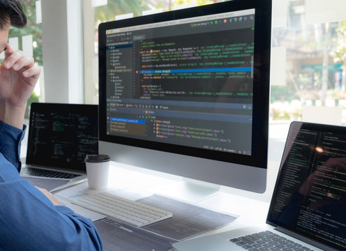 Programmers work on the development of coding and coding technology on white desks and website design, software, data processing companies, servers.