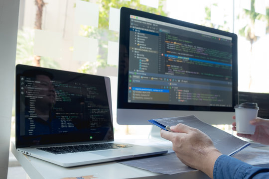 Programmers work on the development of coding and coding technology on white desks and website design, software, data processing companies, servers.