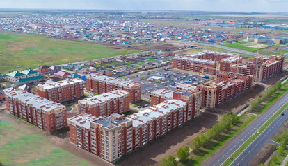 A new, modern, with new houses district of the city, aerial view. The view from the clouds.