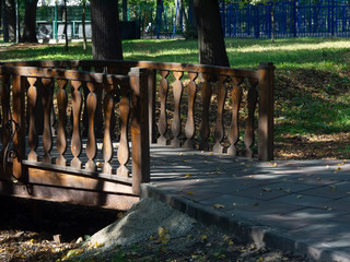 wooden bridge over a ditch in the summer Park, Moscow