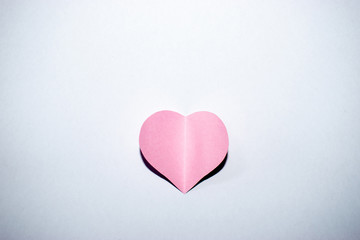 Pink paper heart with white background