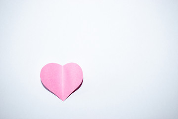 Pink paper heart with white background