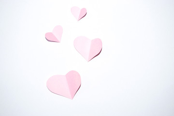 Valentines day background.Pink paper hearts with white background.