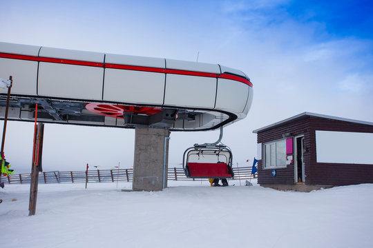 cable car in winter mountain landscape. Bucegi ski slope, Romania