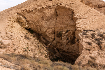 An eroded cave in the desert of Khafs Daghrah, Saudi Arabia