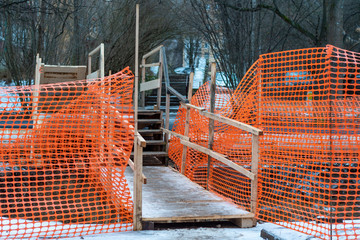 RU, Moscow 01.01.2020: Temporary wooden pedestrian bridge laid through the underground repair zone