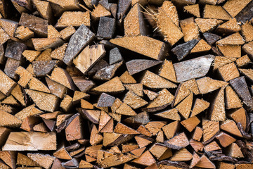 Background of chopped firewood stacked.