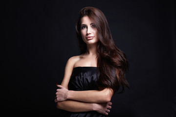 Fototapeta premium Beautiful Hair Girl in black dress. fashion beauty portrait