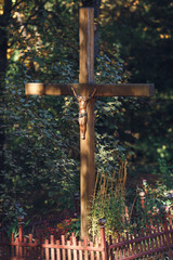 cross with a statue of crucified jesus.