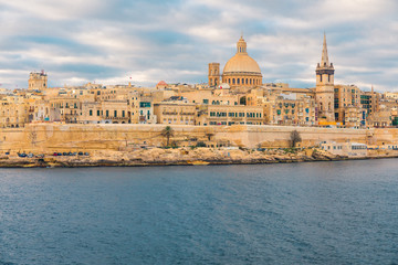 Fototapeta na wymiar Valletta old town skyline during sunrise. Malta
