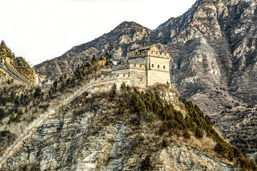 Fototapeta premium Buildings of a fragment of the Great Chinese Wall in the mountains near Bejing