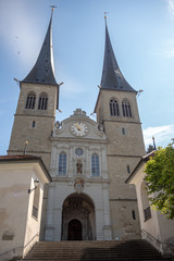 Low angle view of beautiful medieval christ church on clear blue sky background , copy space , Luzern , Switzerland